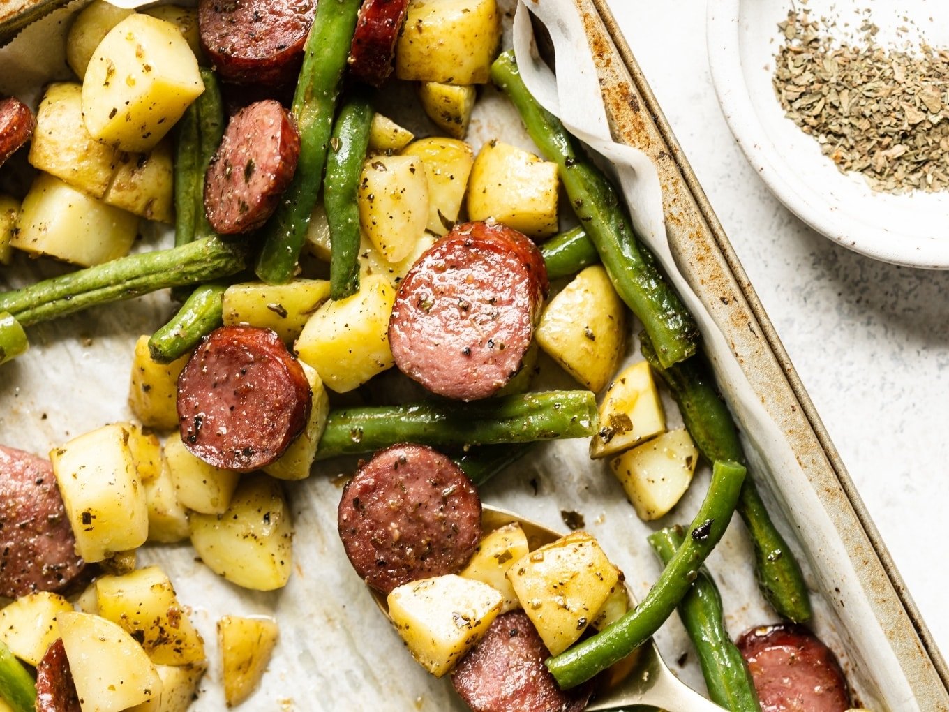 https://thewholecook.com/wp-content/uploads/2021/04/Sausage-with-Potatoes-Green-Beans-by-The-Whole-Cook-horizontal-1.jpg