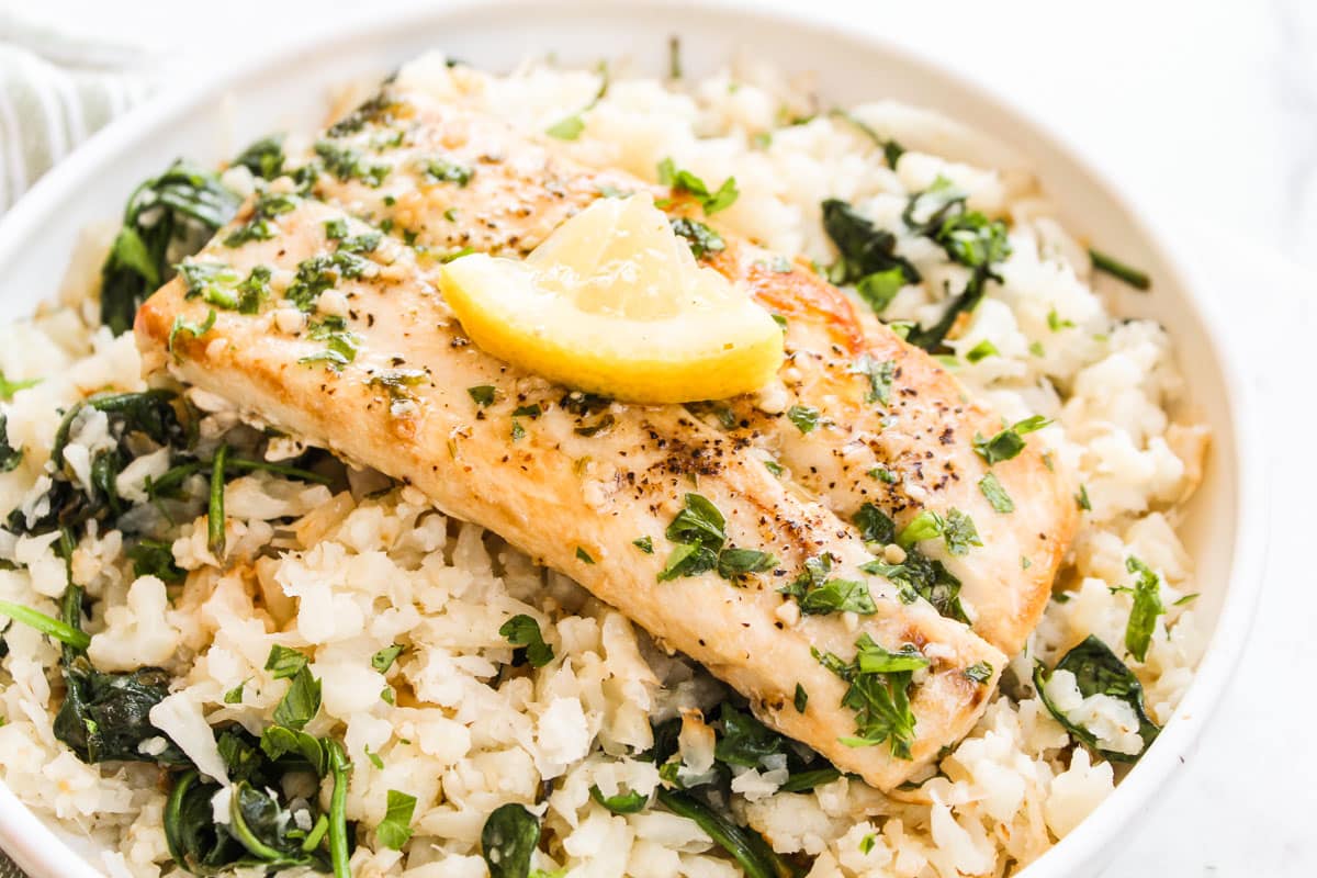 mahi mahi in a bowl with cauliflower rice