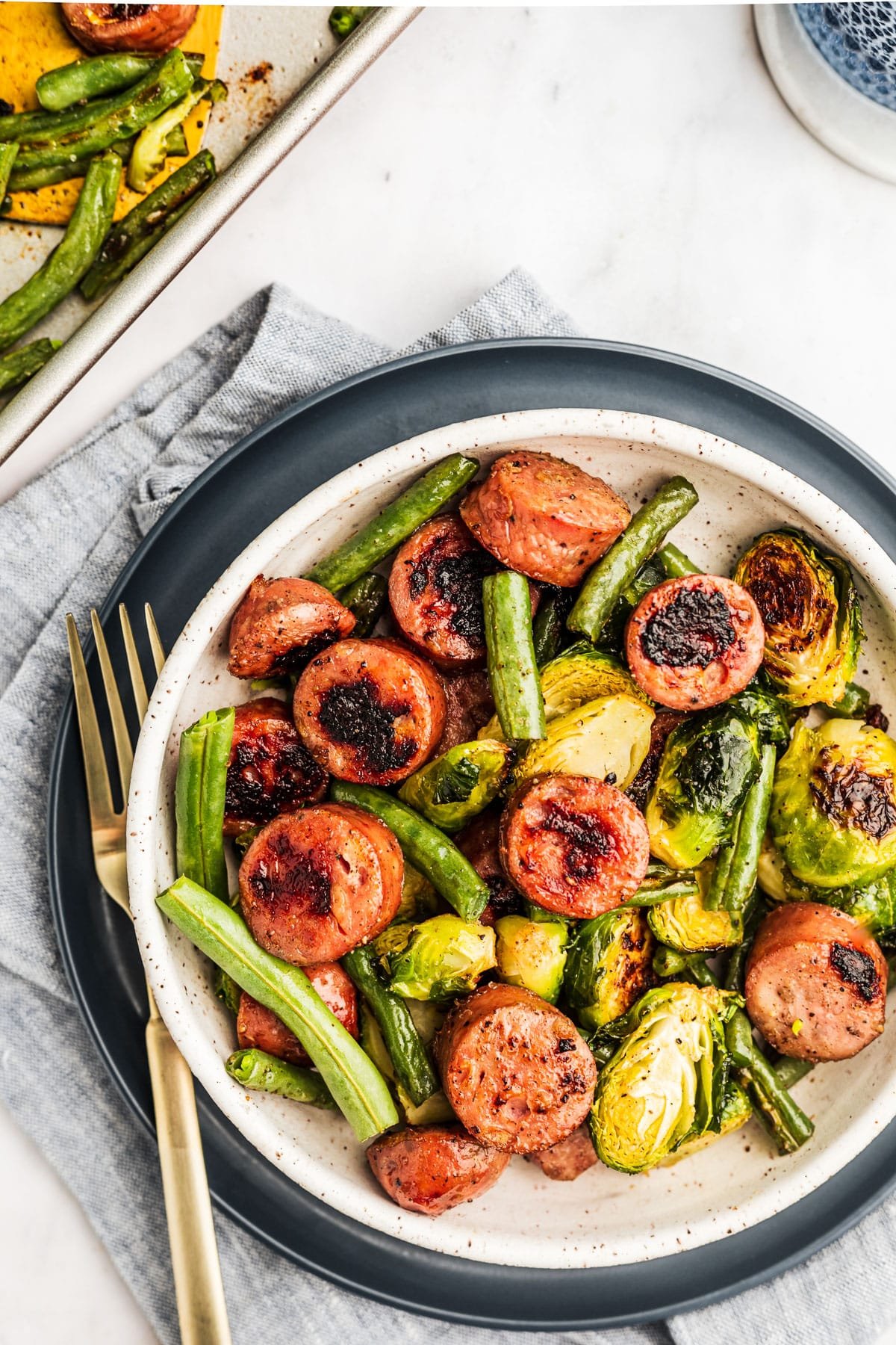 https://thewholecook.com/wp-content/uploads/2023/05/Sheet-Pan-Sausage-and-Vegetables-1-2.jpg
